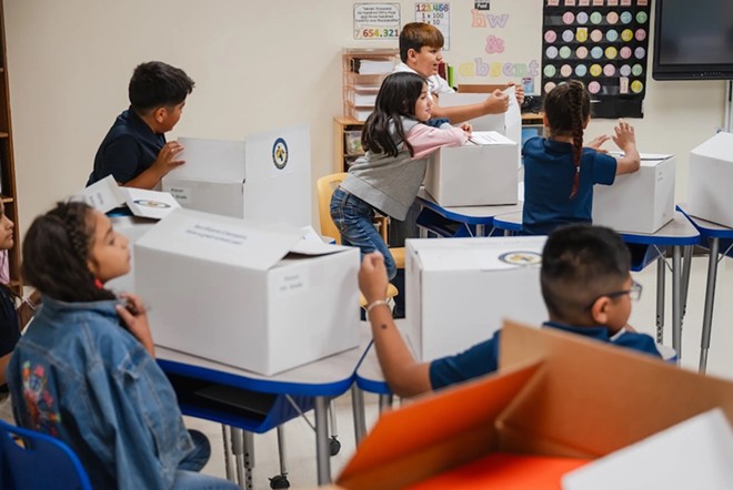 Students at Lorenzo G. Alarcon Elementary School this summer open boxes of school supplies paid for with Elementary and Secondary School Emergency Relief (ESSER) funds in San Elizario. Credit: Texas Tribune / Justin Hamel