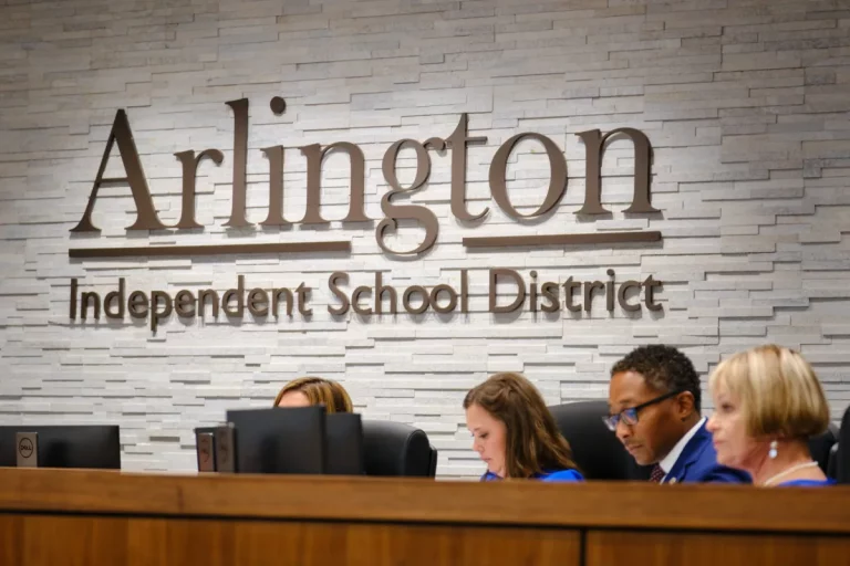 Arlington ISD school board members read material during a meeting on Aug. 1, 2024, at the Arlington ISD Administration Building. (Drew Shaw | Arlington Report)