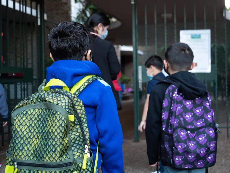 Children head into Benbrook Elementary for the first day of school on Aug. 23, 2021. HISD is requiring masks for all students and staff, and limited virtual learning, but some parents are still worried. Photo Credit: Lucio Vasquez / Houston Public Media