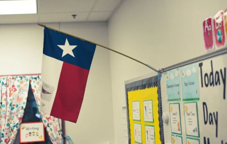 The Lone Star Flag of Texas hangs in an elementary school classroom. / By: Vance Ginn