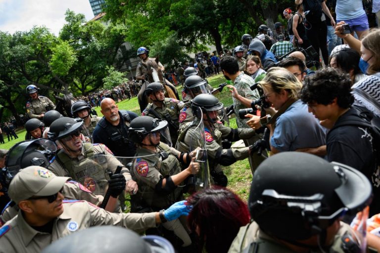 By: Maryam Ahmed / Law enforcement pushes protesters to the edge of the Main Mall lawn during the pro-Palestine demonstration on Wednesday, April 24, 2024. (Credit: Manoo Sirivelu)