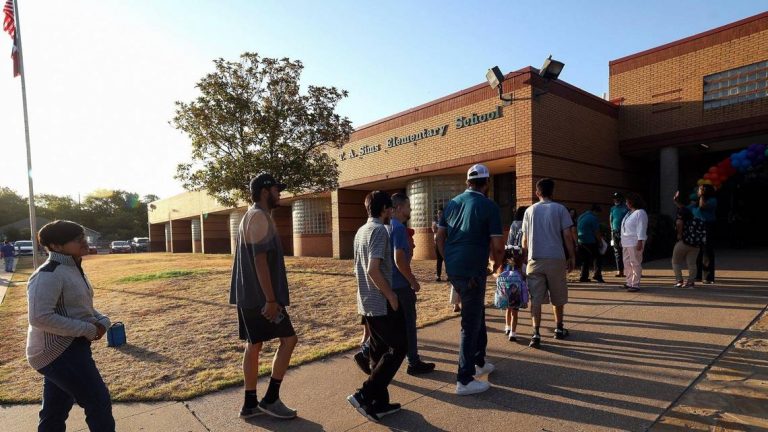 Parents and children arrive at T.A. Simms Elementary School for the first day of school on Monday, August 14, 2023, in Fort Worth. Fort Worth