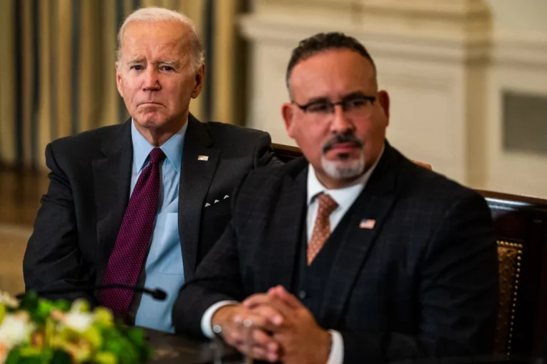 President Joe Biden pictured with his Department of Education secretary, Miguel Cardona, in October 2022. Demetrius Freeman/The Washington Post via Getty Images