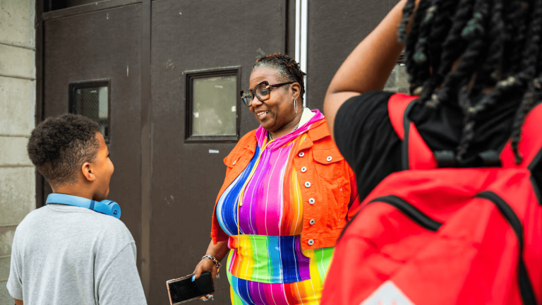 Sylvelia Pittman, a 20-year teacher, speaks to her grandson Cahari at Nash Elementary School in Austin on June 3, 2025. (Colin Boyle/Block Club Chicago)